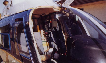 13. Plate 5. An impact with a Western Grebe (3 lbs) caused considerable damage to this helicopter. The bird struck the pilot in the face. Photo courtesy Transport Canada.