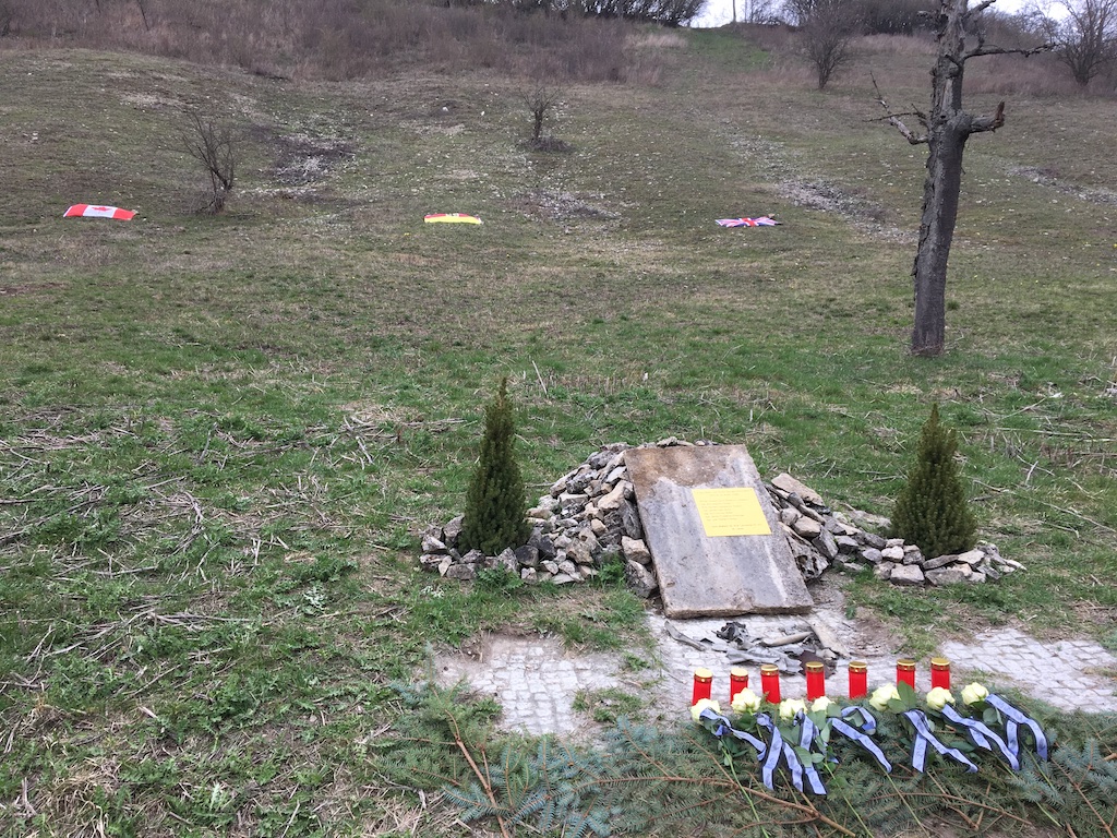 7. Memorial Cairn, Flags, Roses and Candles.