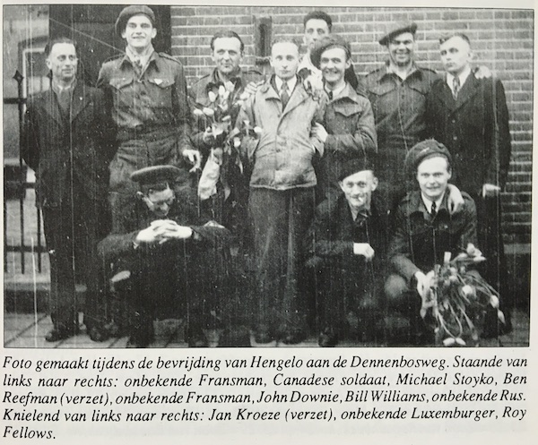 Photo taken during the liberation of Hengelo at the Dennenbosweg. Standing l. to r.- unknown French man, Canadian soldier, Michael Stoyko, Ben Reefman (resistance), unknown French man, John Downie, Bill Williams, unknown Russian. Kneeling l. to r.- Jan Kroeze (resistance), unknown Luxumburger, Roy Fellows. Courtesy of M. Klaassen.